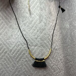 Beaded pendant on a slim chain. 16” around 

Glass beads + gold